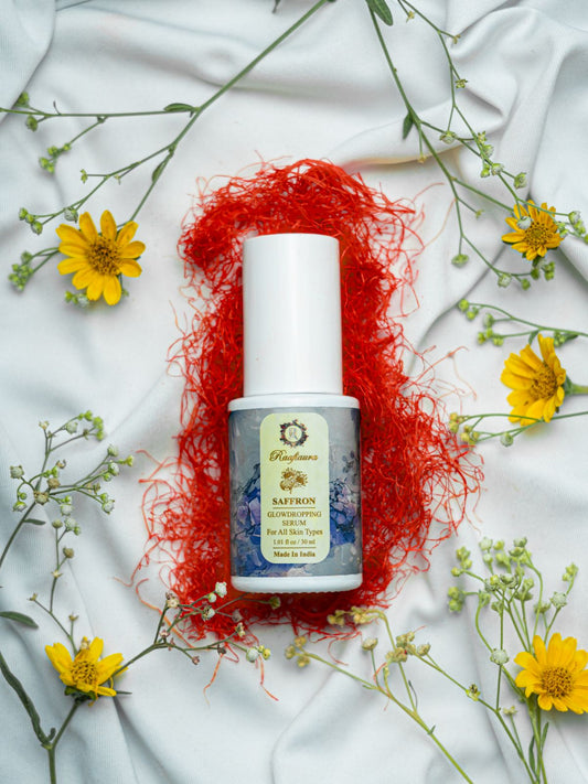 Raafiaura Saffron Glow Dropping Serum on a floral background for glowing skin