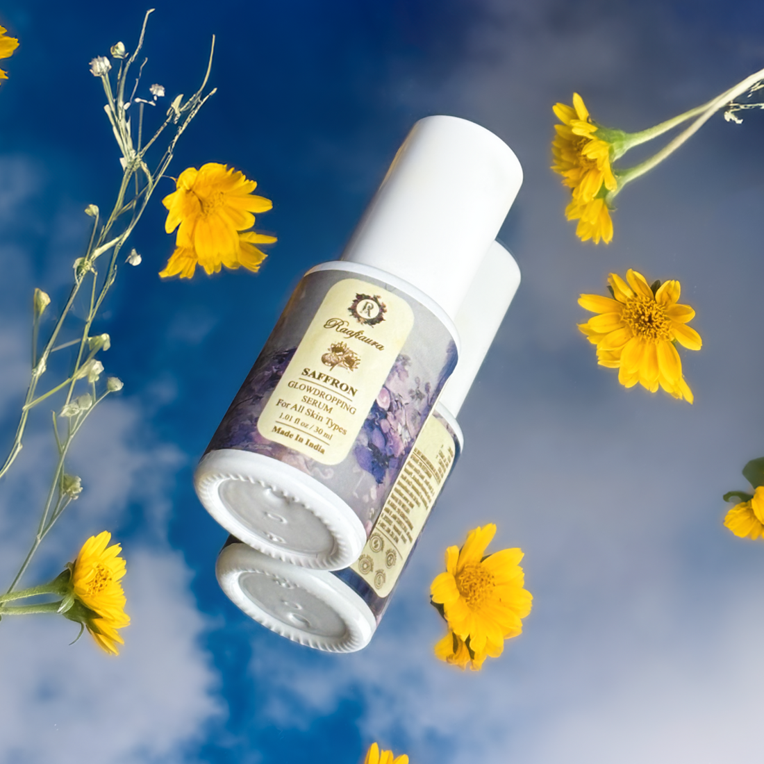 Elegant saffron serum bottle surrounded by vibrant yellow flowers against a blue sky