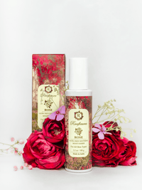 Raafiaura Skin Soothing Rose Moisturiser in a bottle with floral packaging and roses in the background
