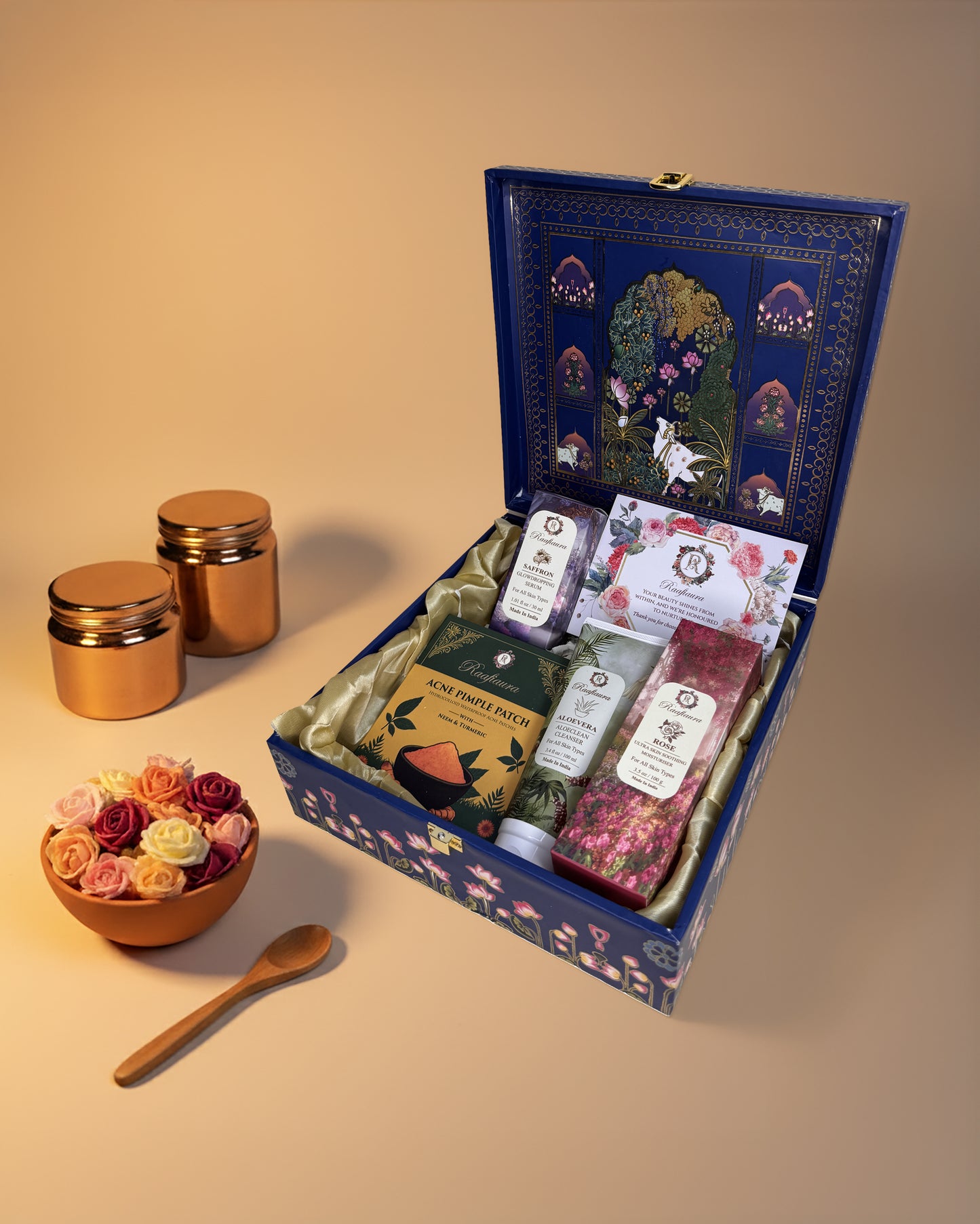 Raafiaura Gifting Box Divine Blossom featuring assorted gourmet items and elegant packaging