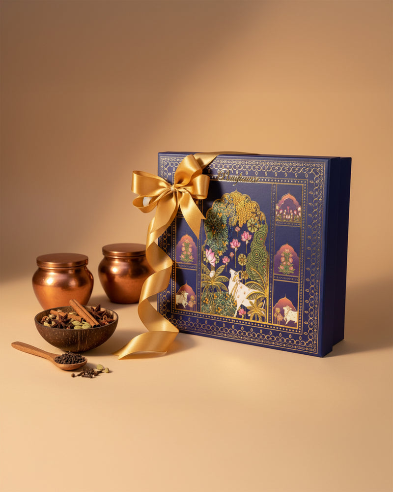 Raafiaura Gifting Box Divine Blossom with elegant design and golden ribbon, featuring spices and decorative jars
