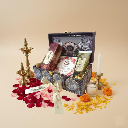 Raafiaura Gifting Festive Bloom luxury gift box featuring artisanal soaps and body lotion on a marble surface